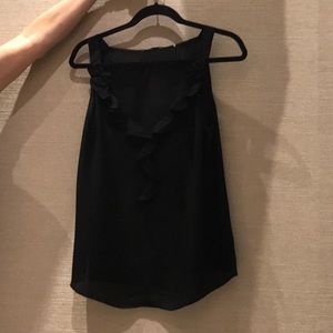 Kombi Hallerinnen black silk sleeveless shirt.